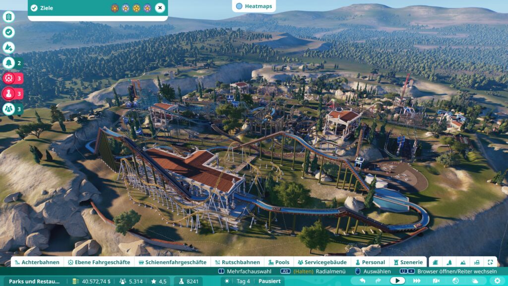 Ein Park in Planet Coaster 2 mit Tempelanlagen, die an das alte Rom erinnern.